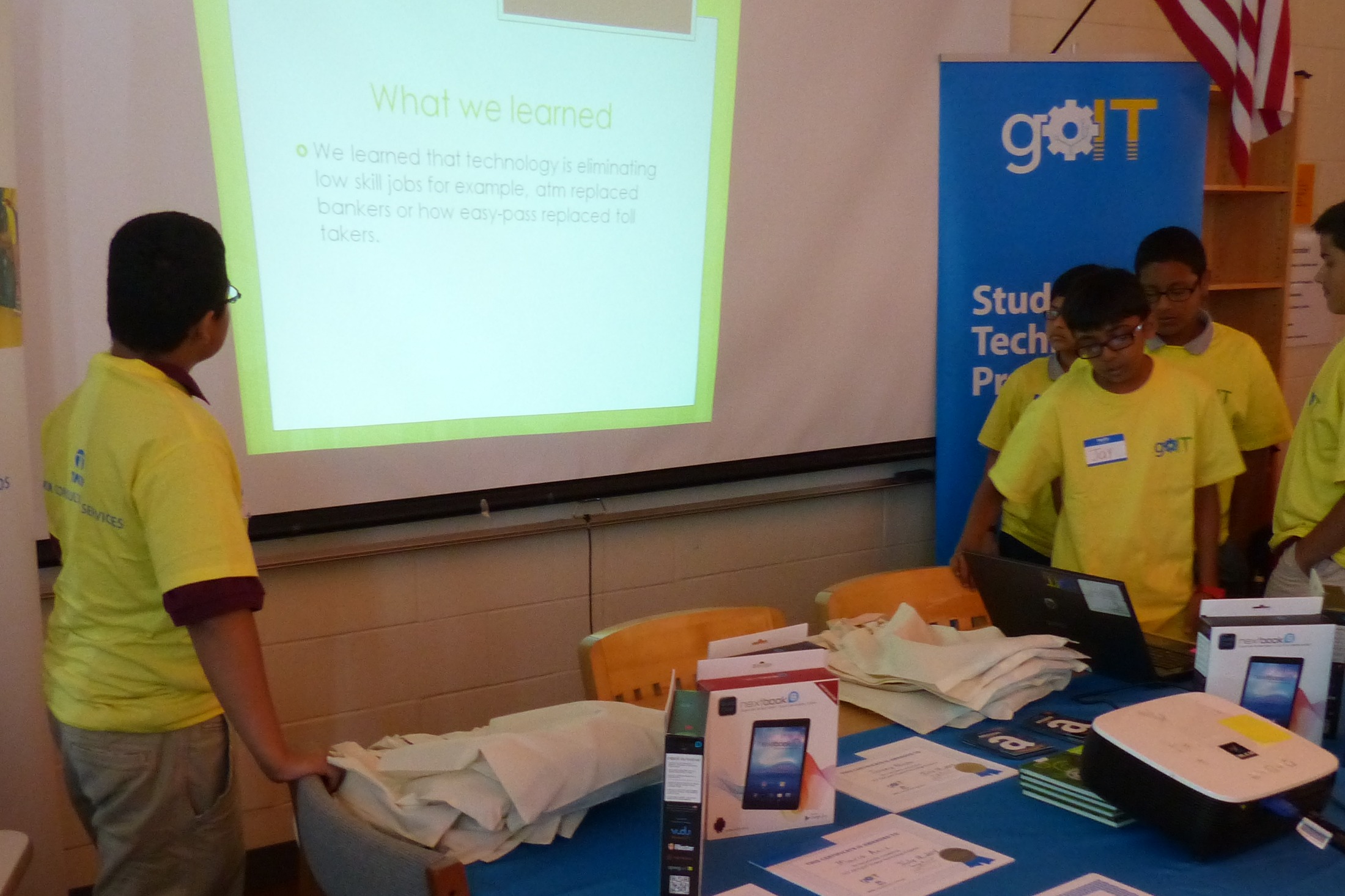 Students at a goIT session presenting computational thinking work to their classmates.